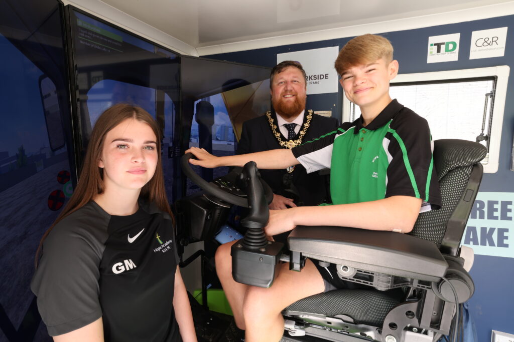 Pupils at Hope Academy using the construction simulator